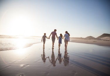 Family walking together on a beach