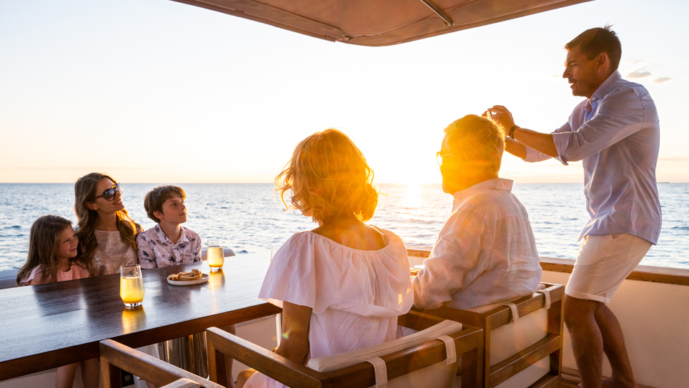 family sat looking out to the ocean