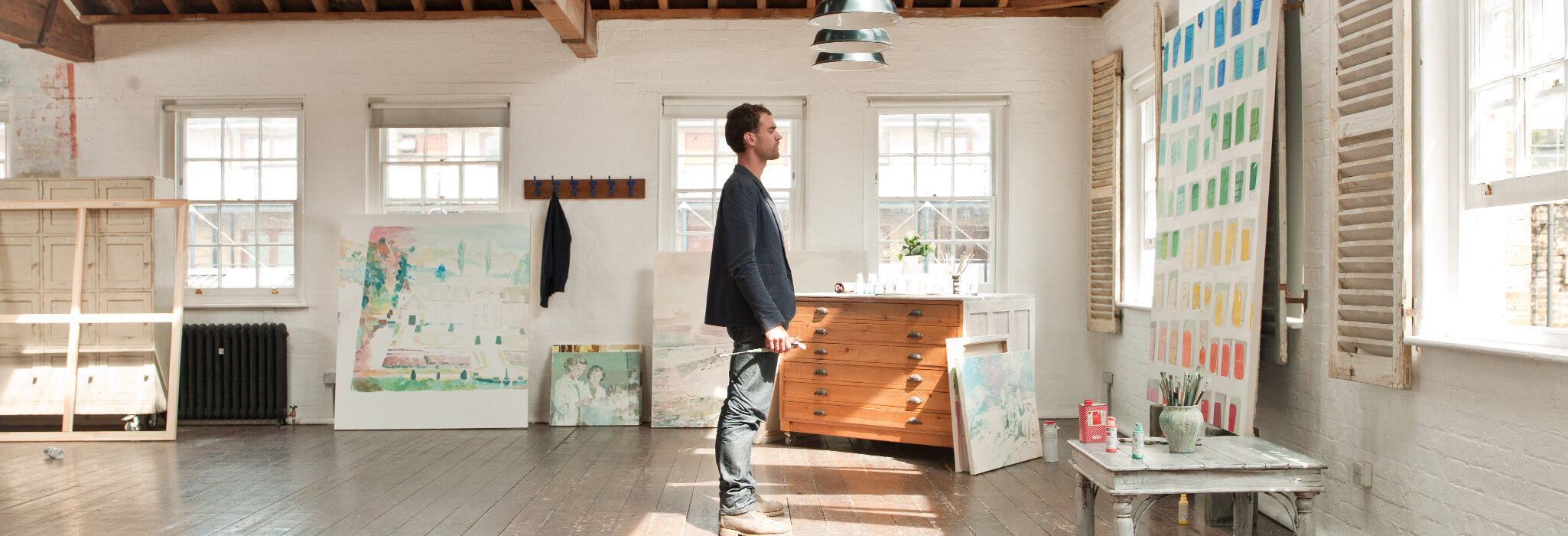 insights-media Image of man looking at a painting