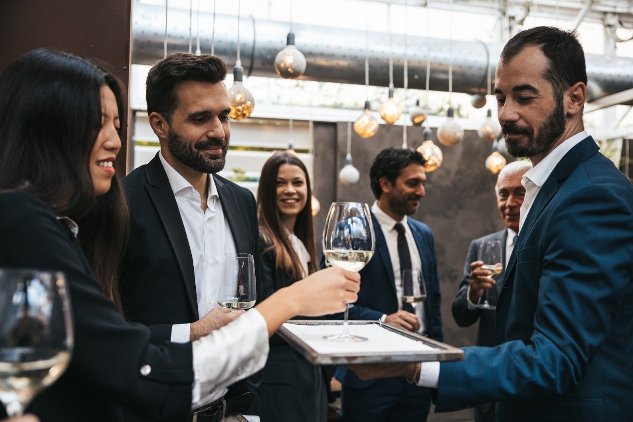 Close up of sparkling wine glasses during a business meeting in a luxury hotel.