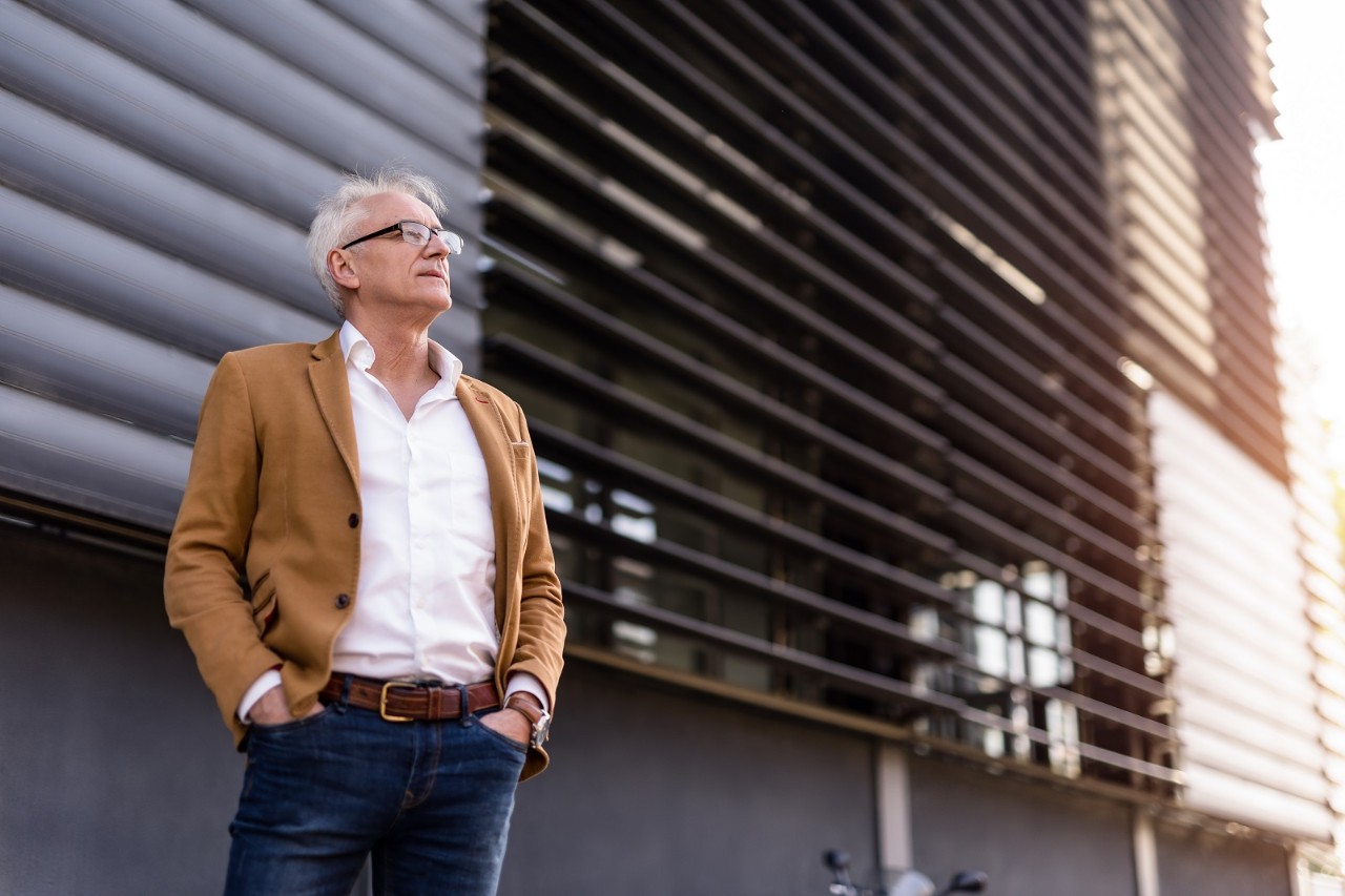 Proud mature businessman contemplating.